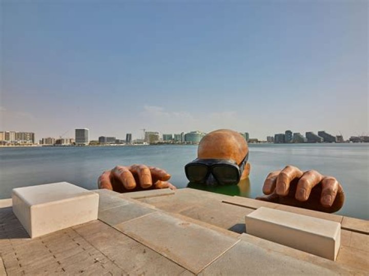 Can spouse work in Abu Dhabi?