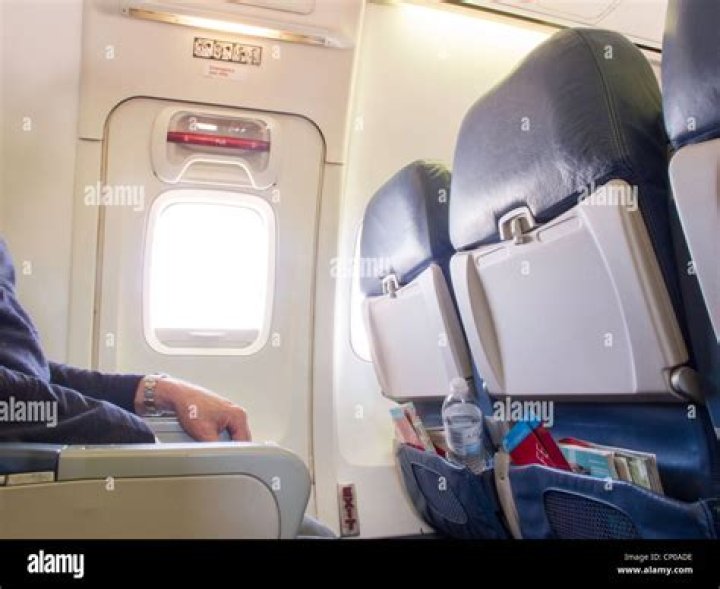 What type of passengers Cannot be seated in an emergency exit row?